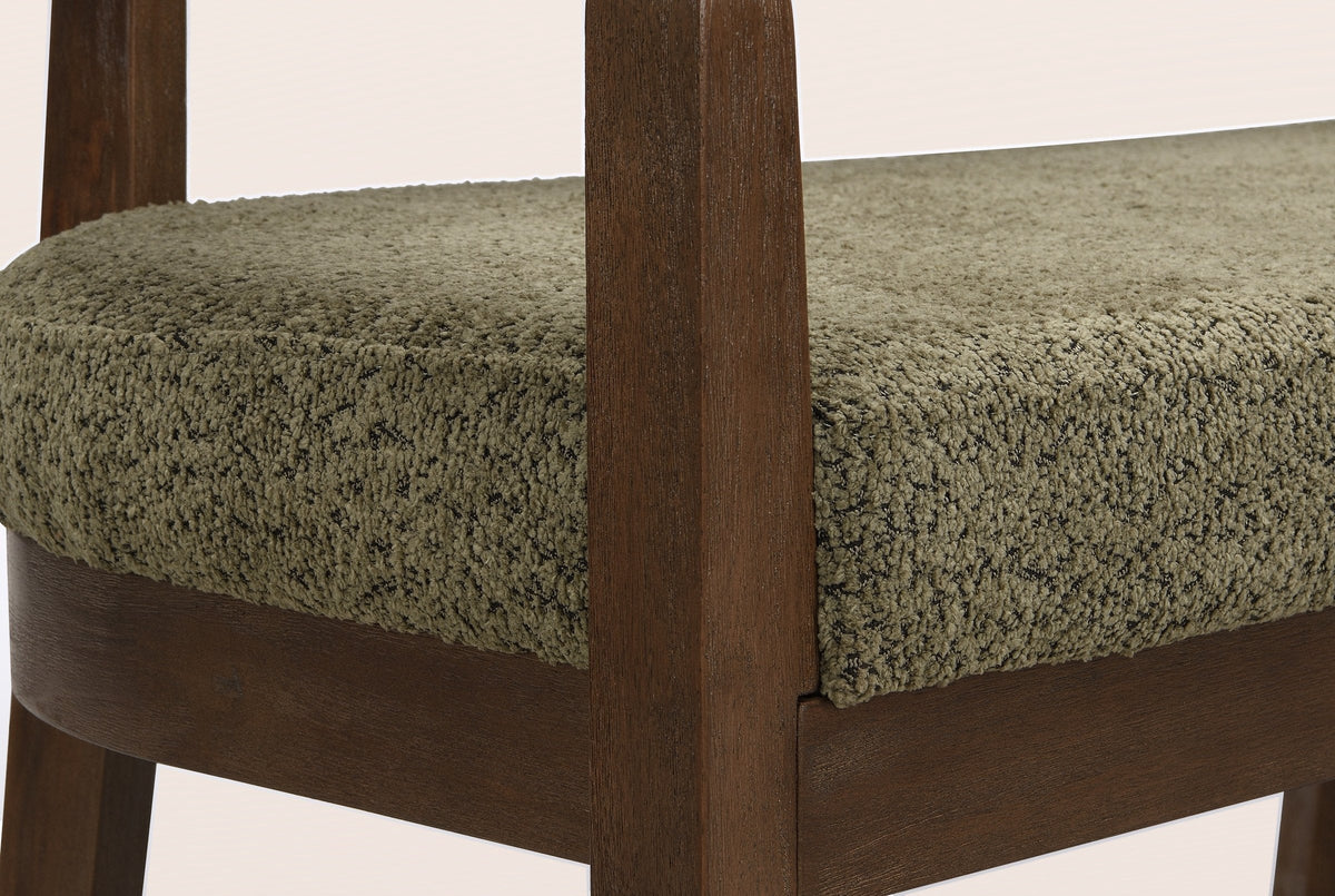 Close-up of the square walnut-finish front post, the seat rail joint and the green seat pad