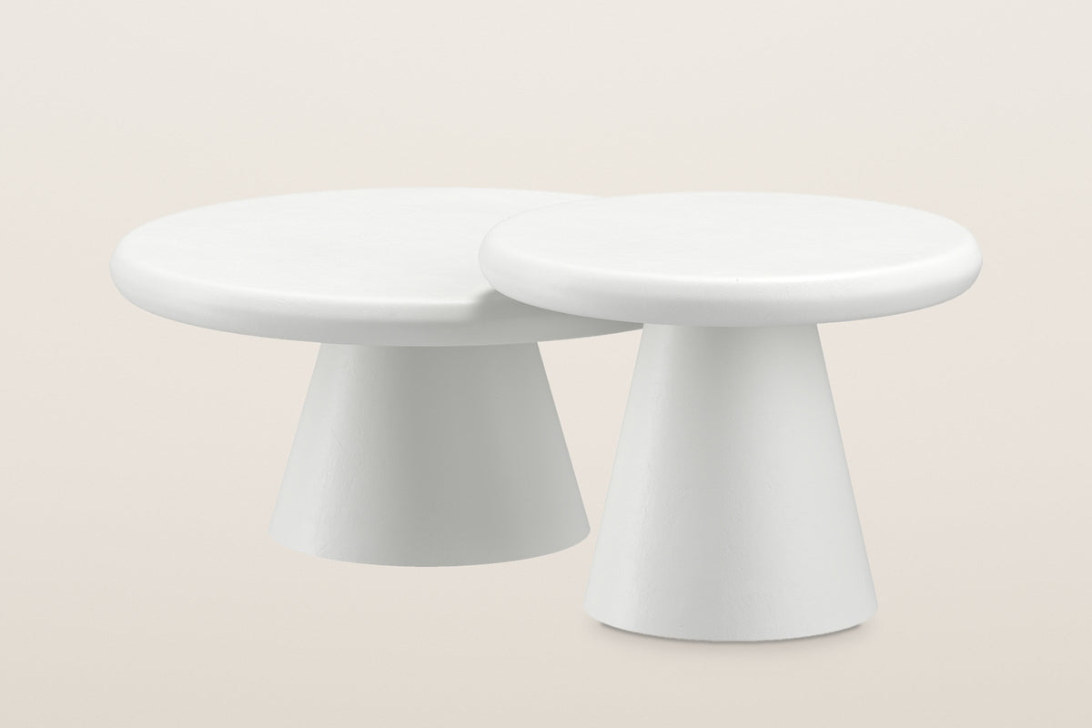 The two Levico coffee tables nested: the small table's higher top slid over the edge of the large top