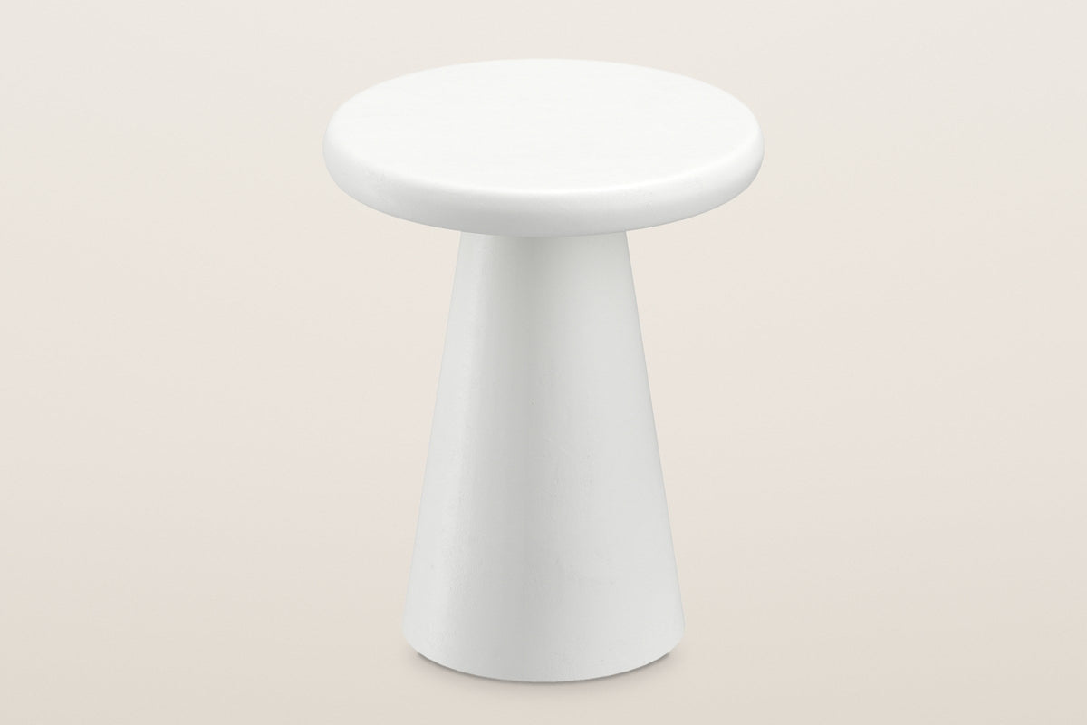 Levico side table seen from above: the thick round white top with its rounded edge over the cone pedestal