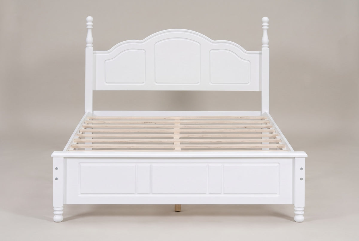 Loreto bed in white, straight front view: arched three-panel headboard, turned finials and five-field footboard