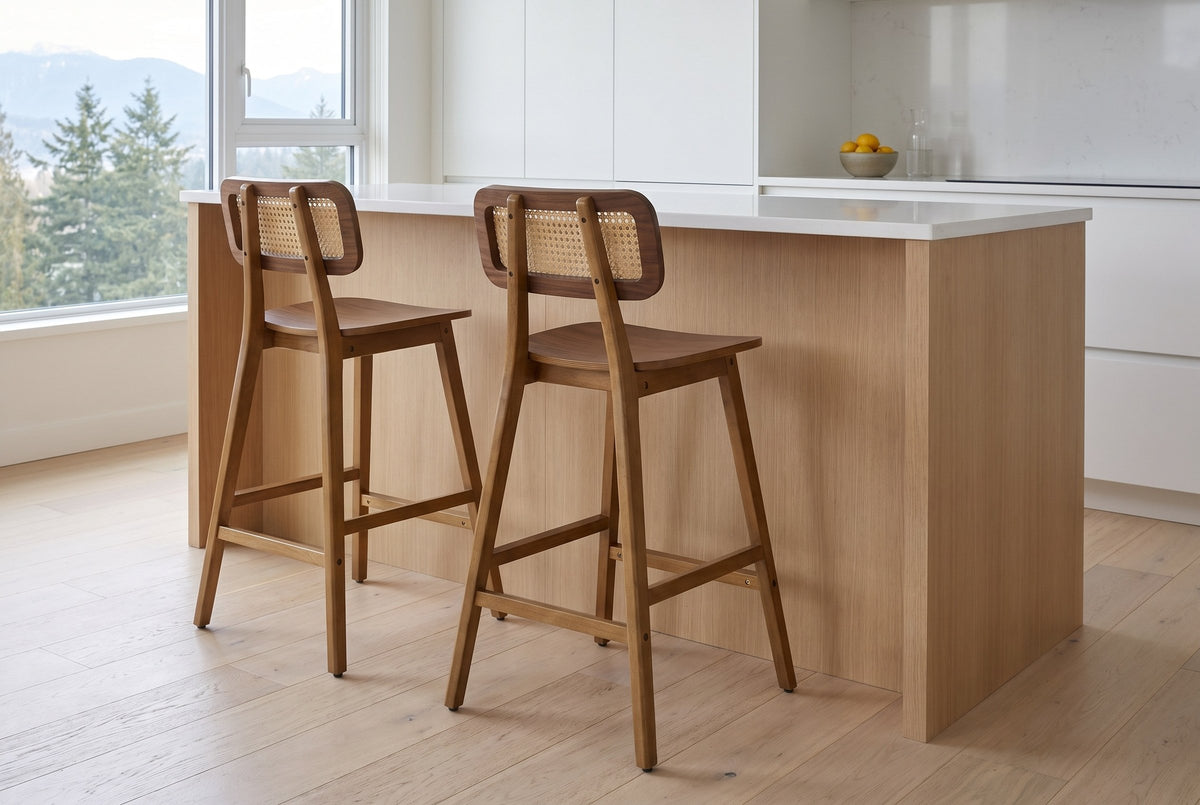 Two Lovere counter stools at a white-oak island with a white quartz counter in a bright Vancouver kitchen, seen from behind