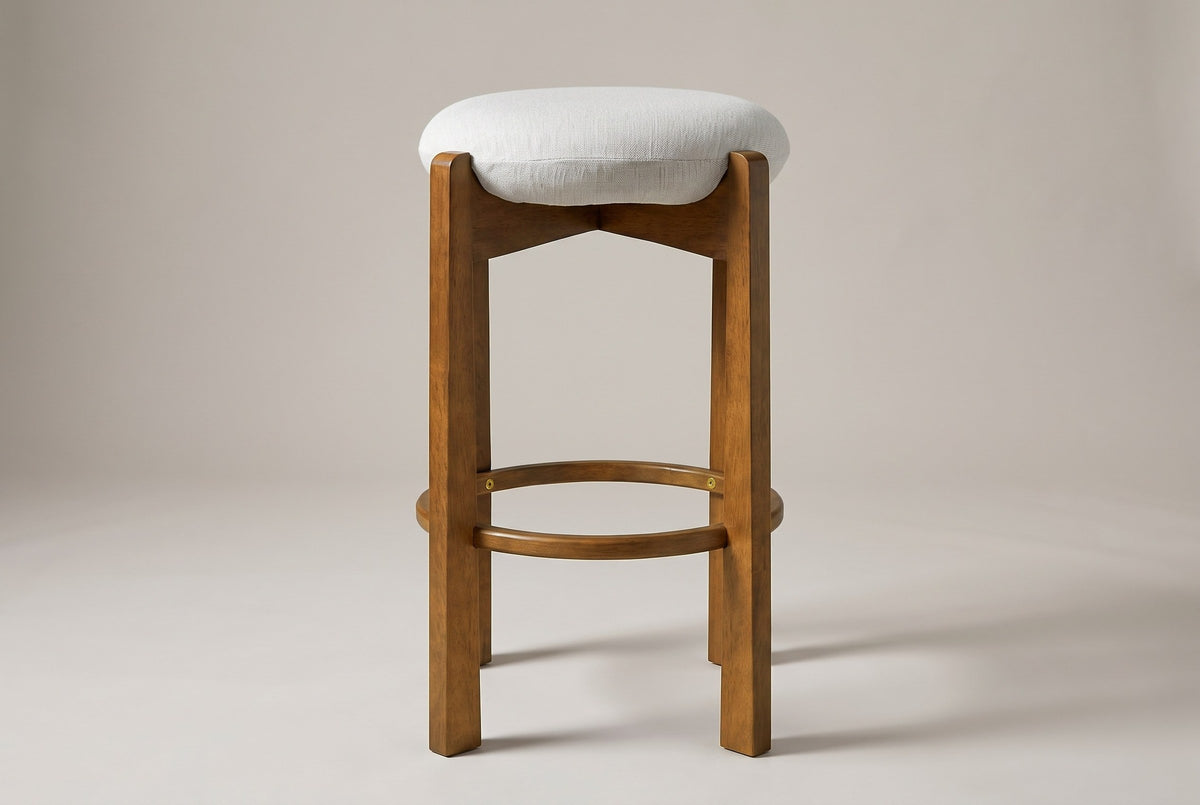Lucera bar stool in Dark Walnut, straight front view: thin round linen-look cushion, four square legs and a round footrest