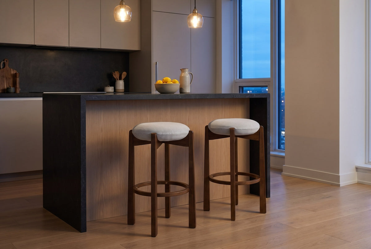 Two Lucera bar stools in Dark Walnut at a stone-topped island with a white-oak front in a Toronto condo kitchen at dusk