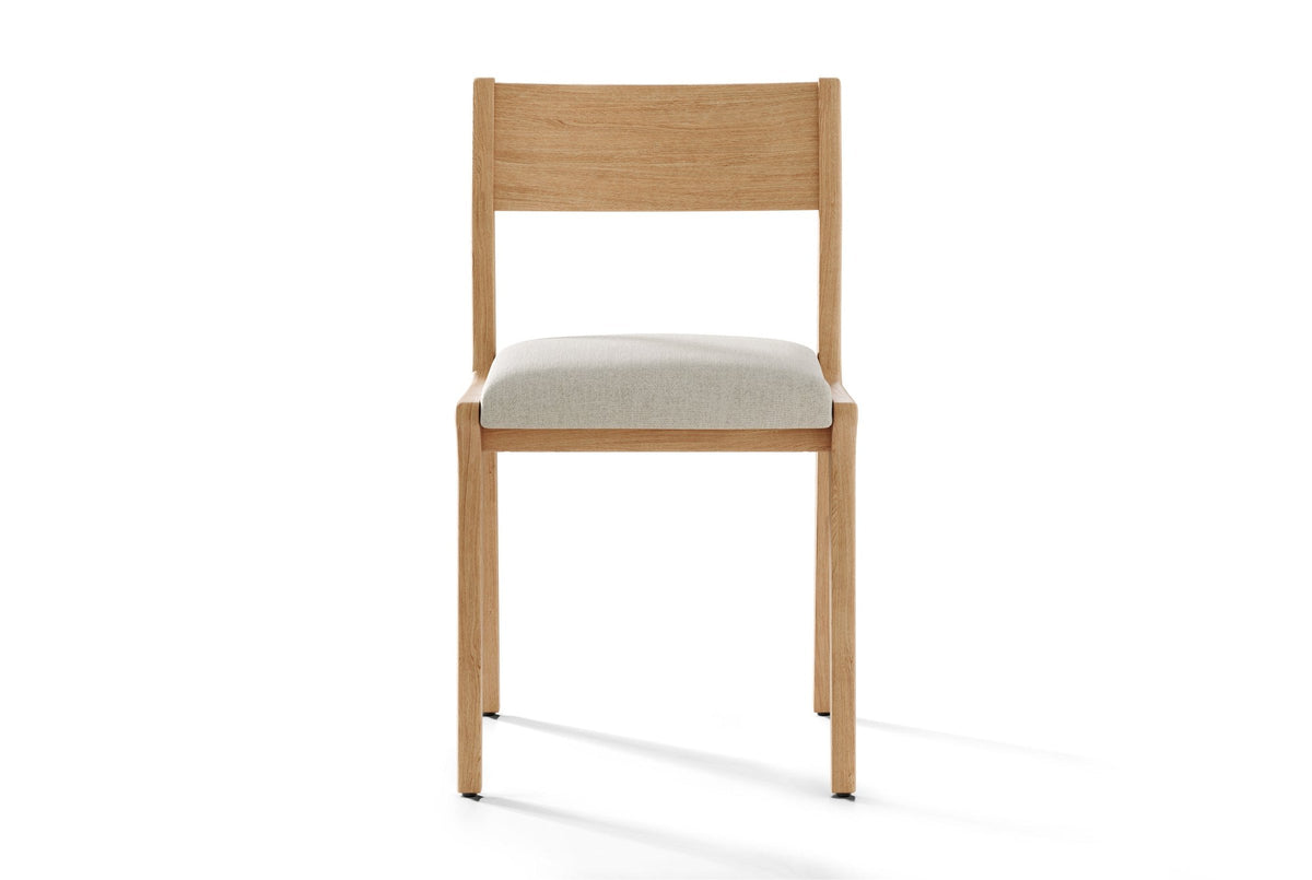 Lucrezia dining chair in the White Oak finish with an off-white fabric seat, seen from the front on a white background