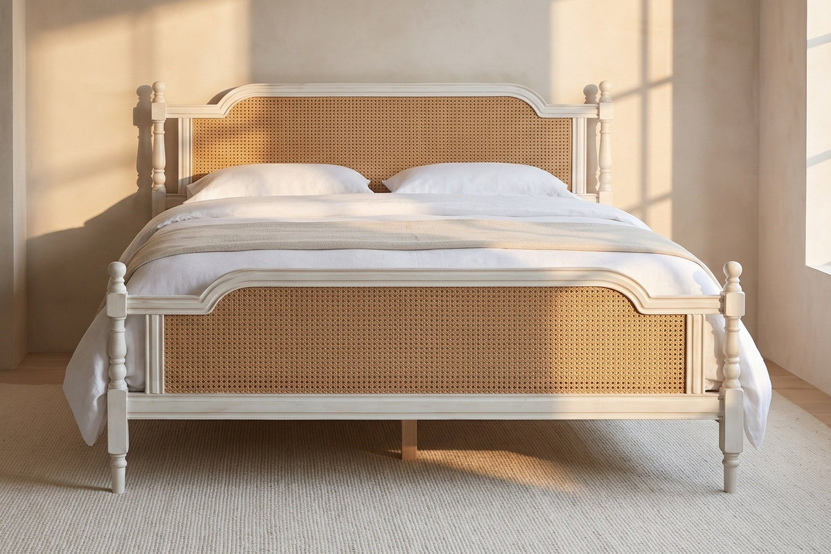 Manarola bed in a plaster-walled bedroom at golden hour