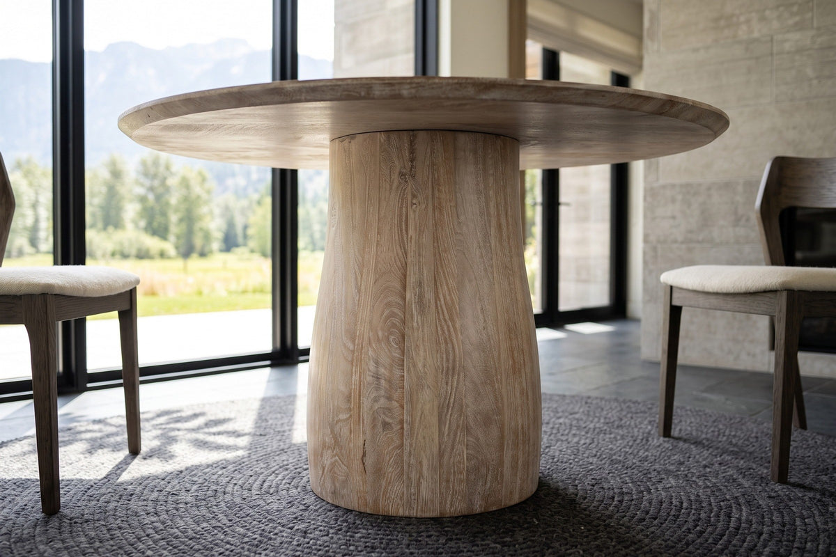 The Marano pedestal in Natural White Wash at seat height: upright mango staves under the thin round top