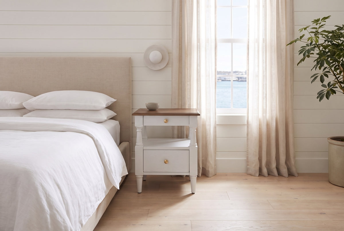 Marsala nightstand in Milk White beside a bed with white linen in a white shiplap Halifax bedroom with a harbour view
