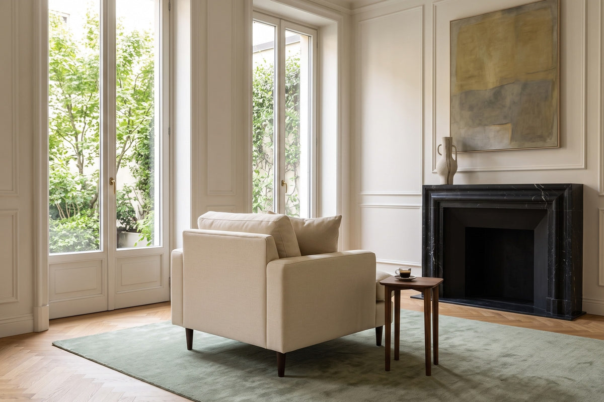 Mombaruzzo accent chair in a Brera apartment in Milan, with plaster mouldings
