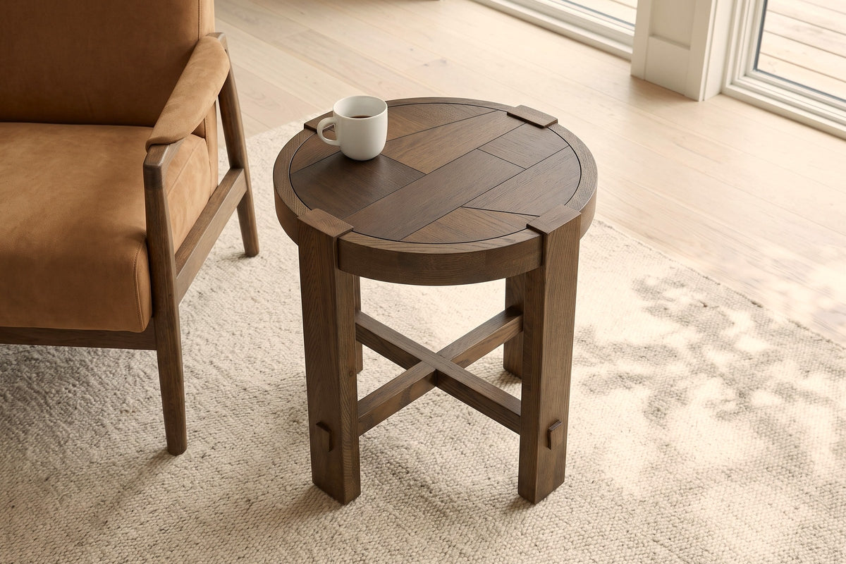Mondavio side table in Smokey Chestnut seen from above beside a camel suede armchair in a Lakefield river house