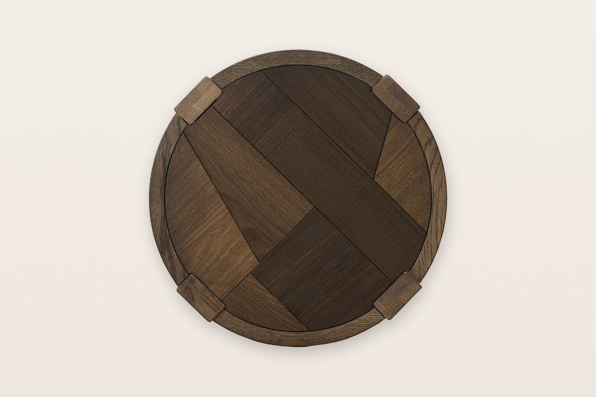 The Mondavio top seen from above in Smokey Chestnut: an oak mosaic inside a round rim