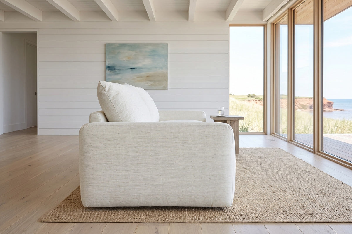 Montecassiano sofa in Cream from the arm end in a North Rustico house on PEI, with white painted boards