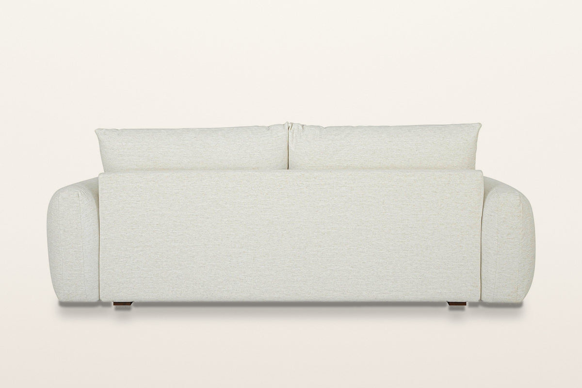 Montecassiano sofa in Cream from behind on a warm white studio backdrop: a plain back panel between the rounded arms