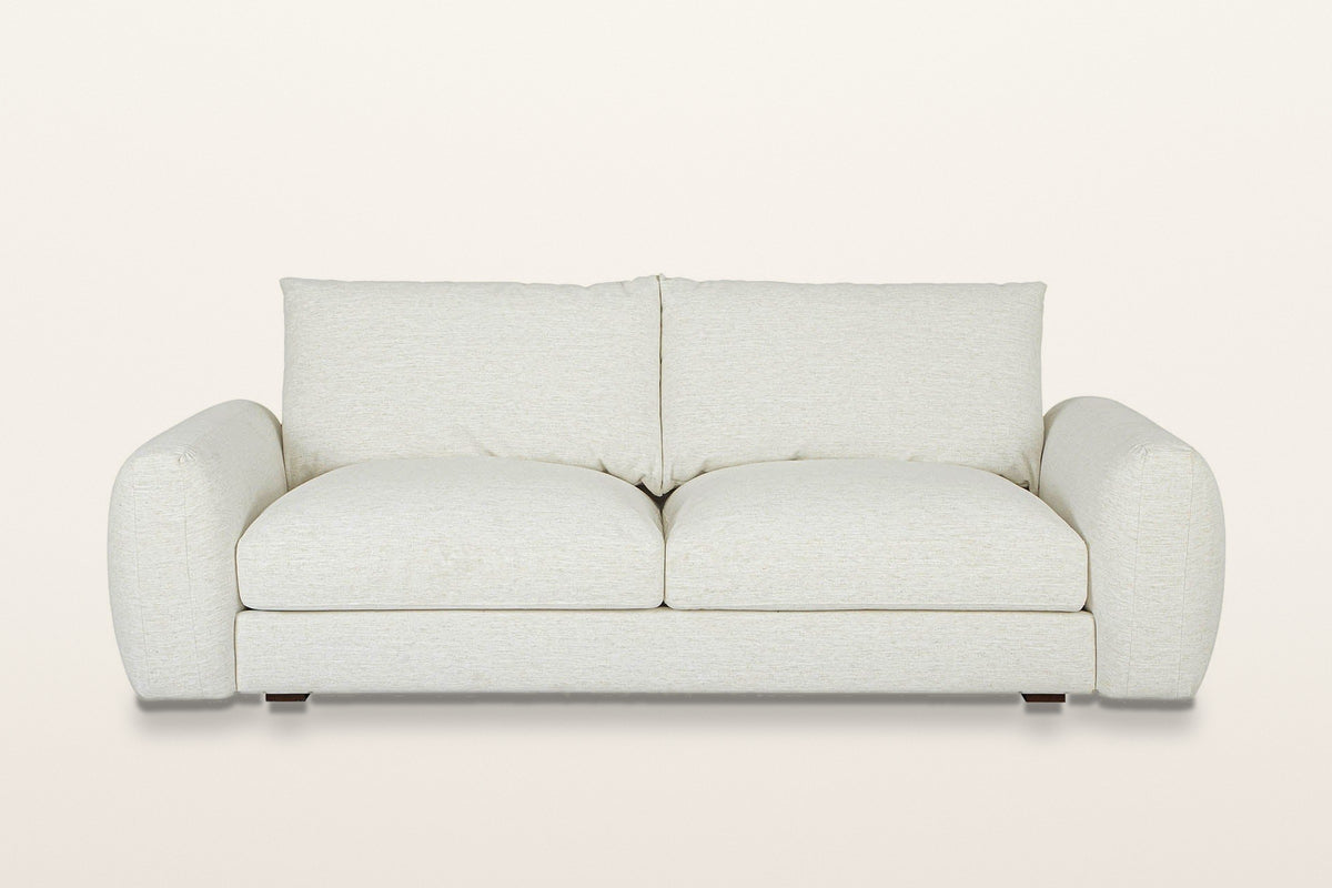 Montecassiano sofa in Cream, straight front view on a warm white studio backdrop: two seat cushions and two back cushions bet