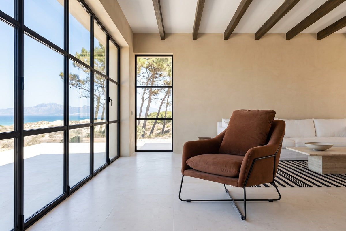 Montelupone accent chair in Rust in a Tarifa house above the Strait of Gibraltar