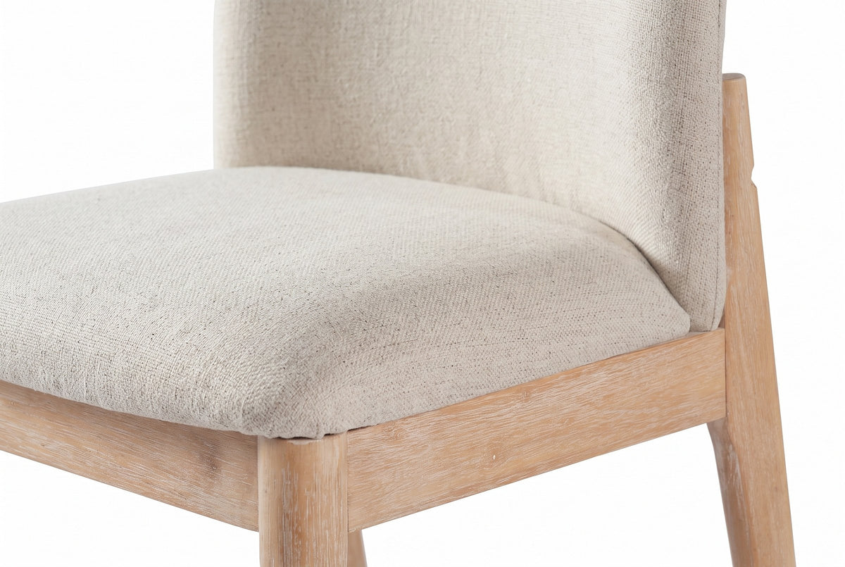 Close-up of the Monteriggioni padded seat and back pad in beige fabric above the brushed wood apron