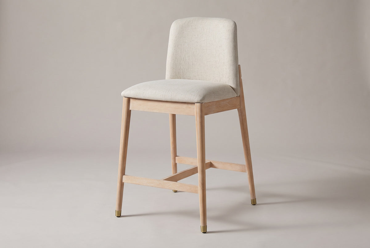 Monteriggioni counter stool with a brushed natural rubberwood frame and a beige upholstered seat and back pad