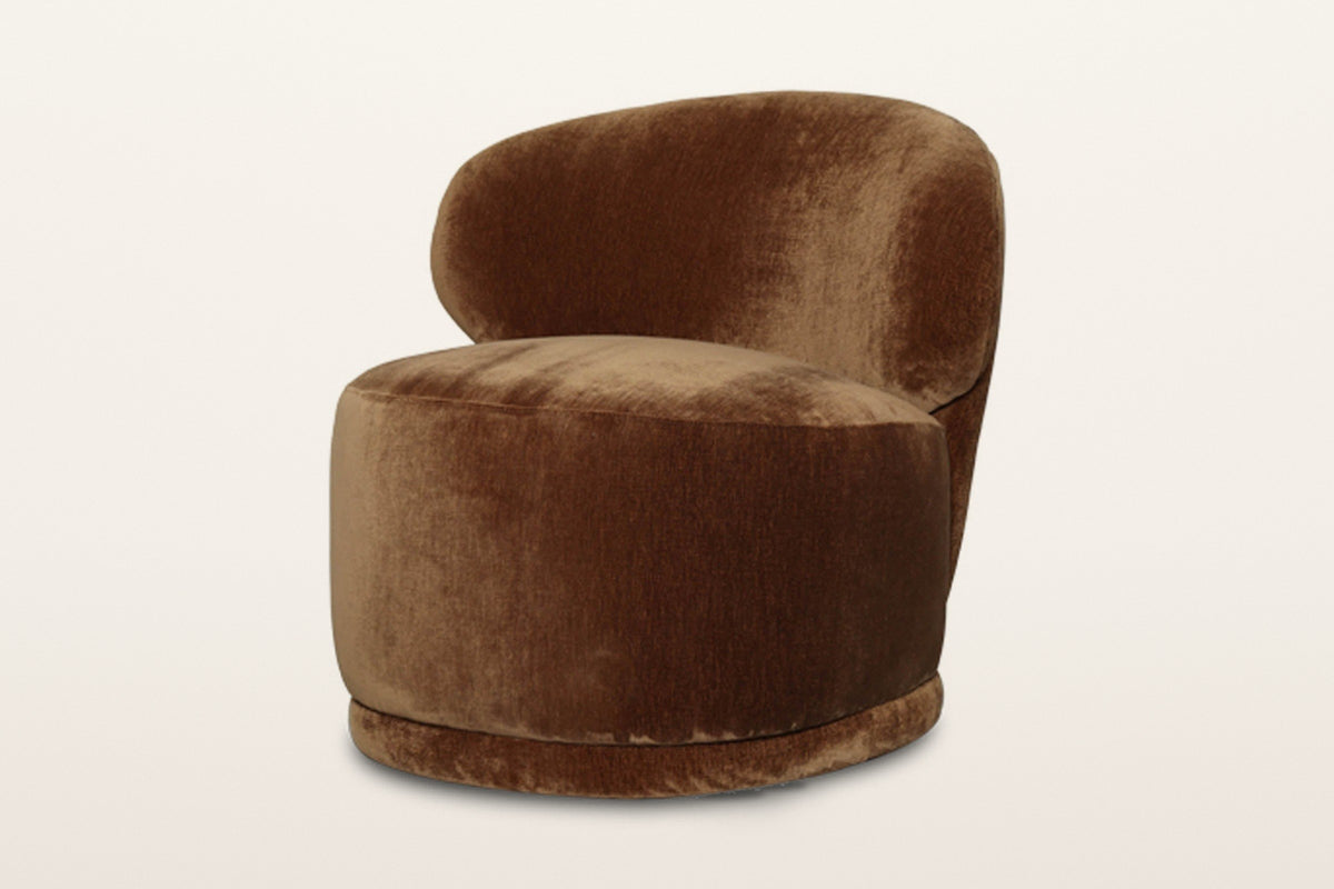 Monterubbiano accent chair in Bronze velvet, three-quarter view on a warm white studio backdrop