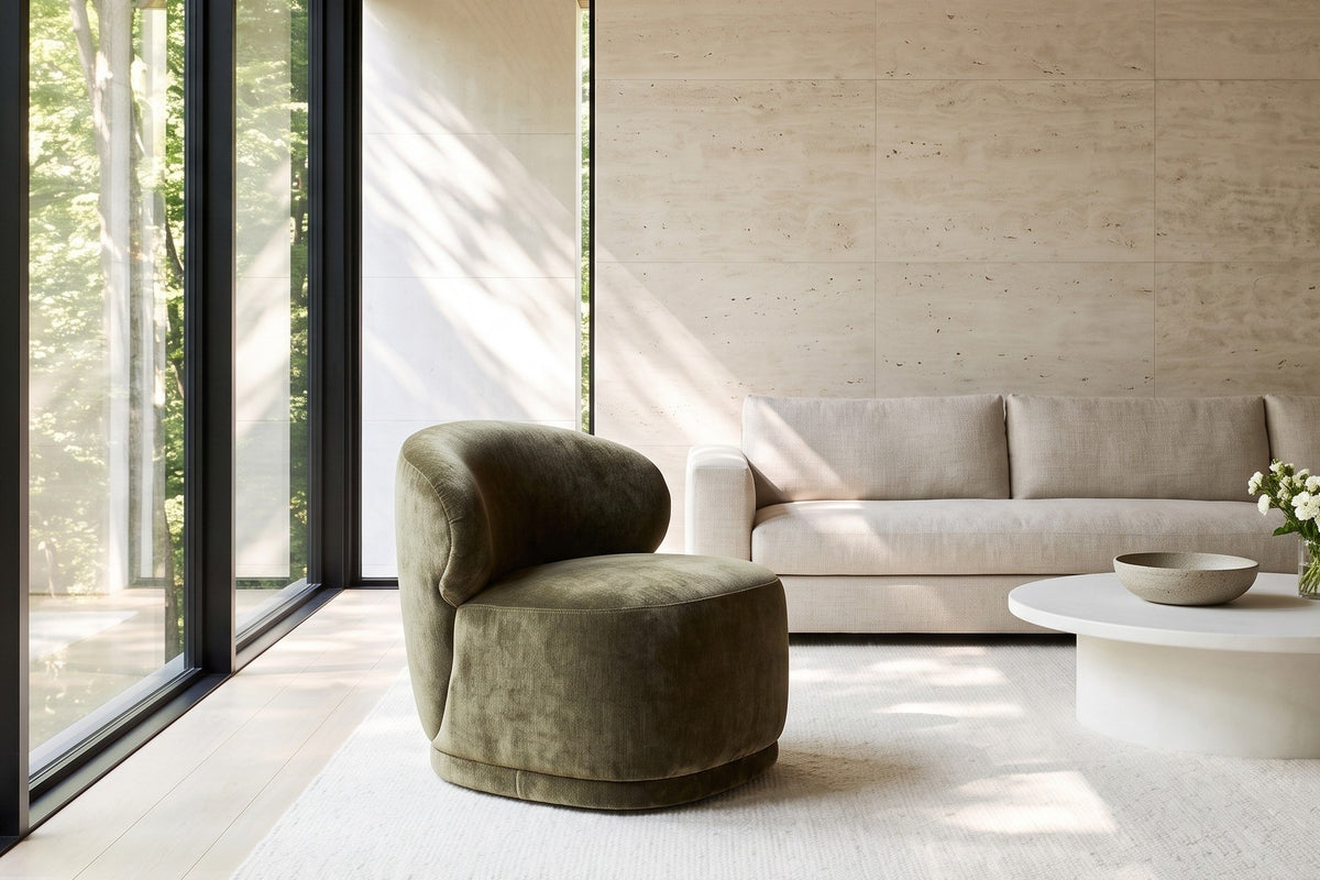 Monterubbiano accent chair in Khaki Green velvet in a Forest Hill ravine house in Toronto, a travertine wall