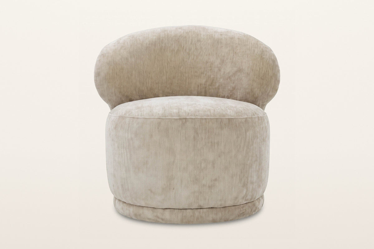 Monterubbiano accent chair in Natural velvet, straight front view on a warm white studio backdrop: the rounded back above a r
