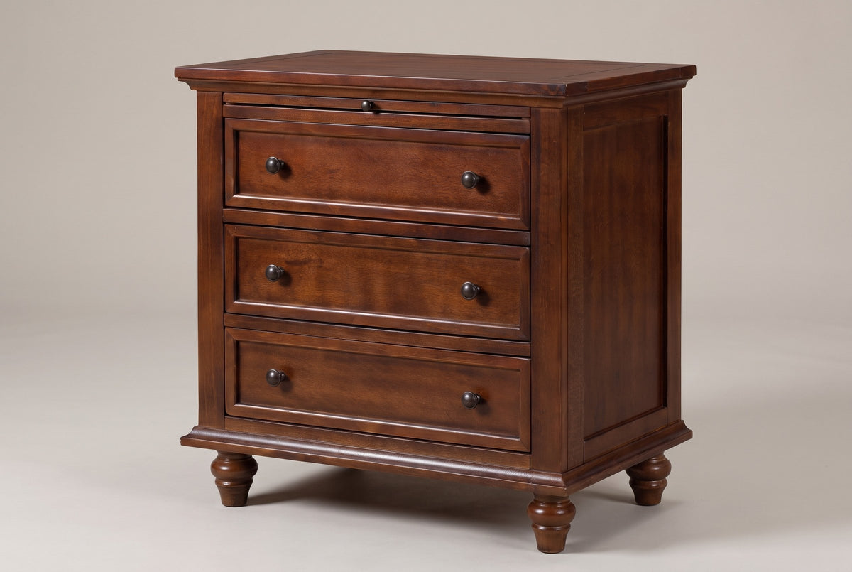 Nervi 3-drawer nightstand in Brown, three-quarter view on a warm grey studio backdrop