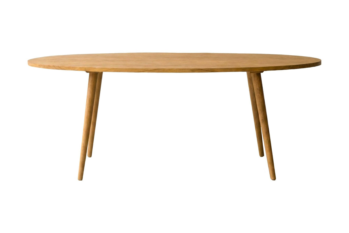 Nolan solid acacia oval dining table, side view of the top edge and tapered legs