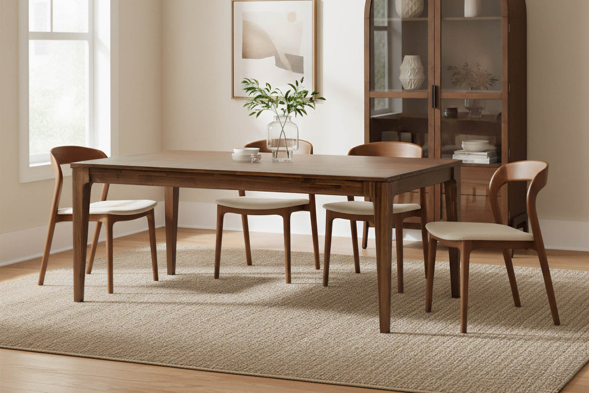 Norwood dining chairs at a rectangular walnut table in a bright dining room