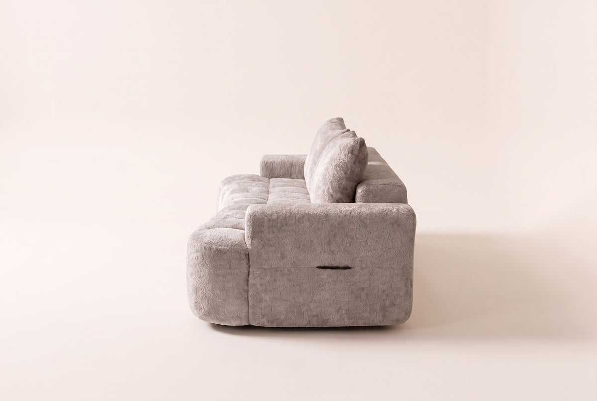 The Nuvola sofa in Camel seen from one end, showing its depth and low arm