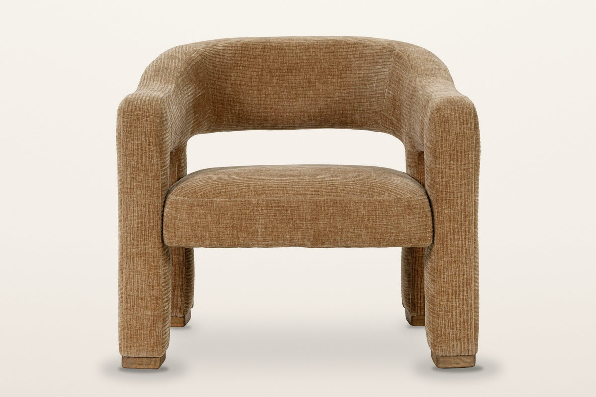 Opi accent chair in Chai, straight front view on a warm white studio backdrop: the arms dropping straight into thick legs