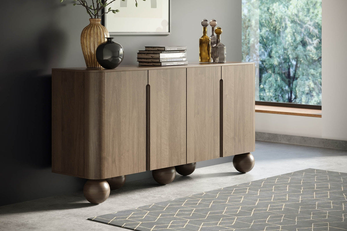 Orson natural mango wood sideboard beside a large window