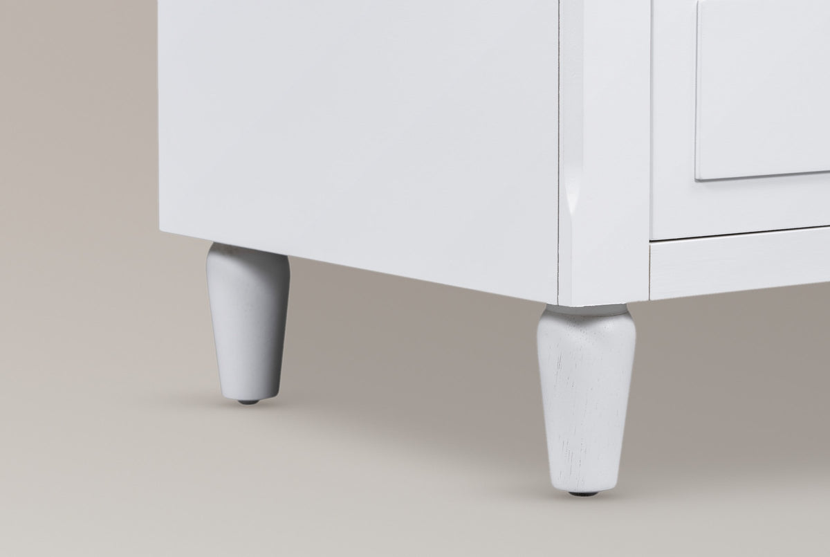 Close-up of the white-painted turned Ortona legs and the chamfered front corner of the case