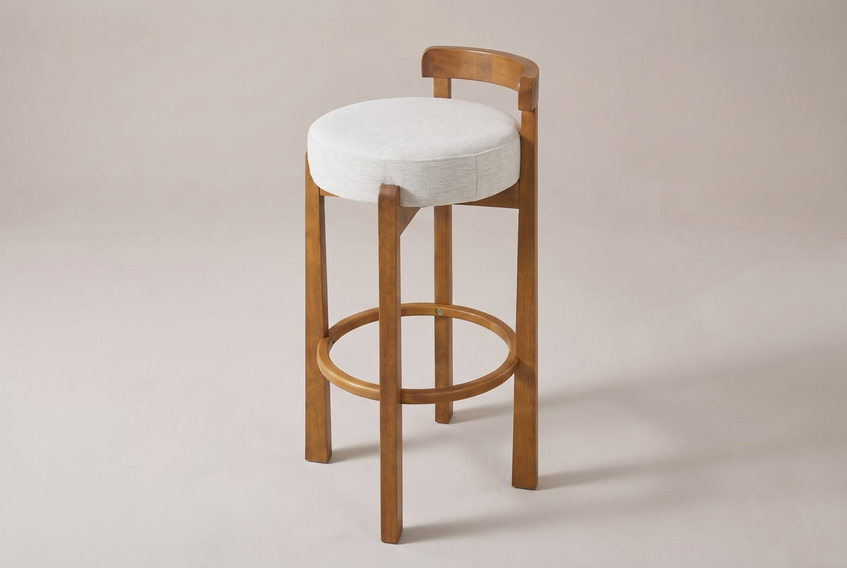 Otricoli bar stool in Ivory woven fabric, three-quarter view on a warm grey studio backdrop