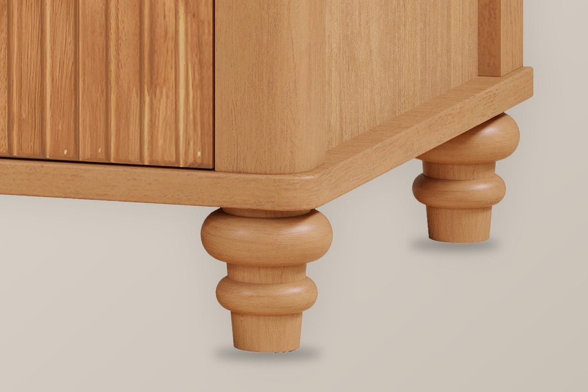 Close-up of the Palestrina base in Natural: the rounded corner post and plinth corner