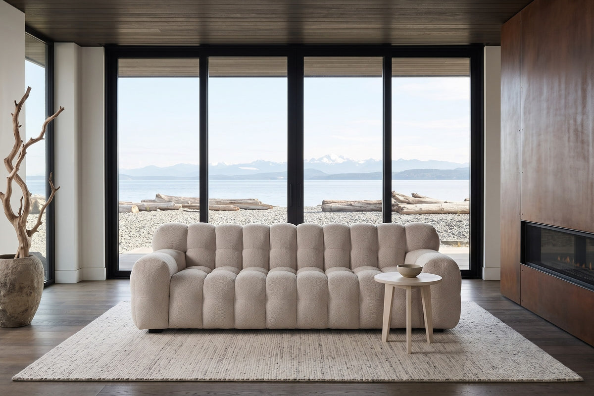 Pergola sofa in Beige facing the glass in a Comox beach house, a dark cedar ceiling