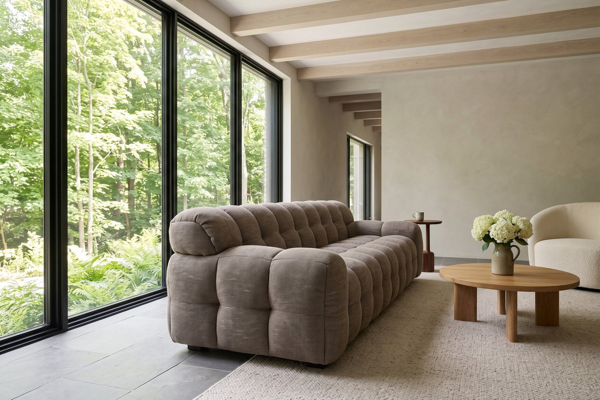 Pergola sofa in Brown seen low from the front right in a Glen Williams house, limewash walls