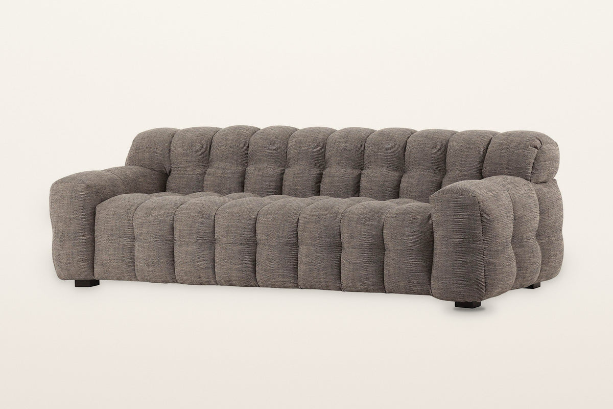 Pergola sofa in Brown, three-quarter view on a warm white studio backdrop