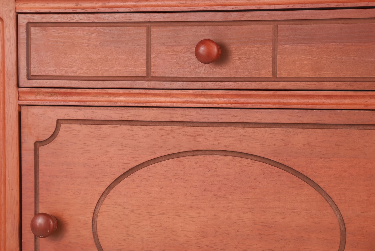 Close-up of the Perugia drawer front with three routed panels and a round wooden knob