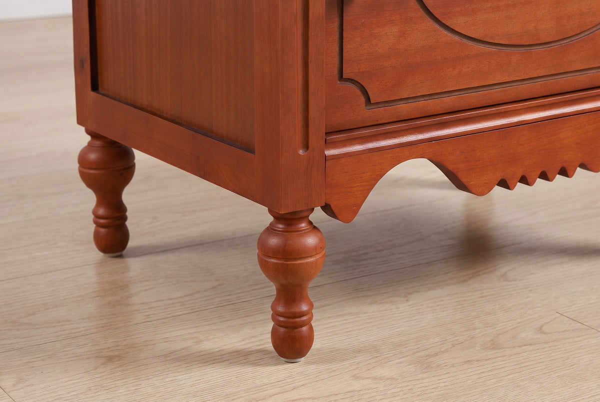 Close-up of a turned gourd leg, the grooved corner post and the scalloped apron of the Perugia nightstand