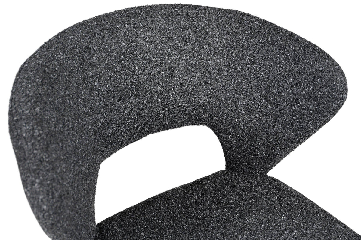 Close-up of the Petralia back in Dark Grey: the curved shell, its open window and the textured fabric