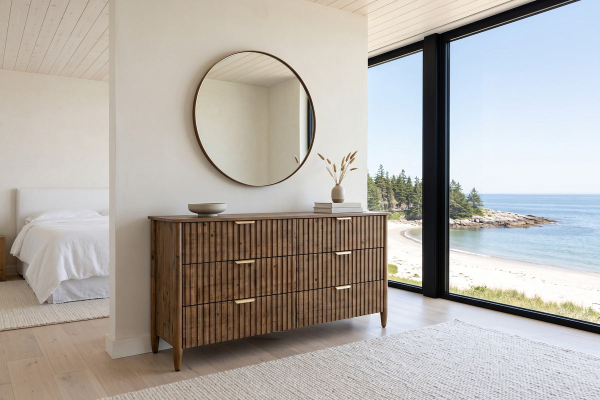 Pettorano dresser in Brown reclaimed pine under a round mirror in a Lockeport beach house bedroom, with lime plaster walls