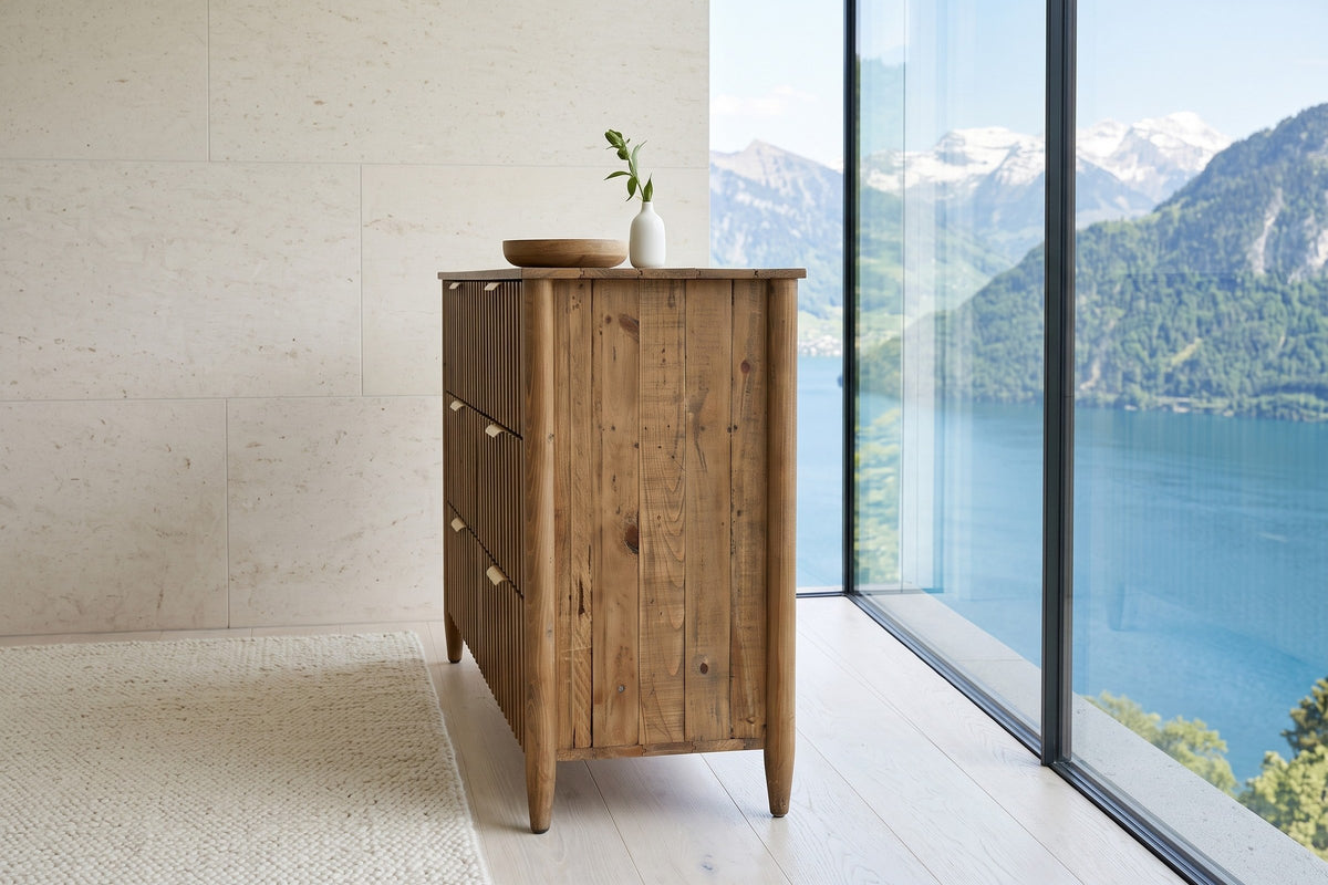 End view of the Pettorano dresser in Brown in a Lucerne lake house: the planked end between round posts