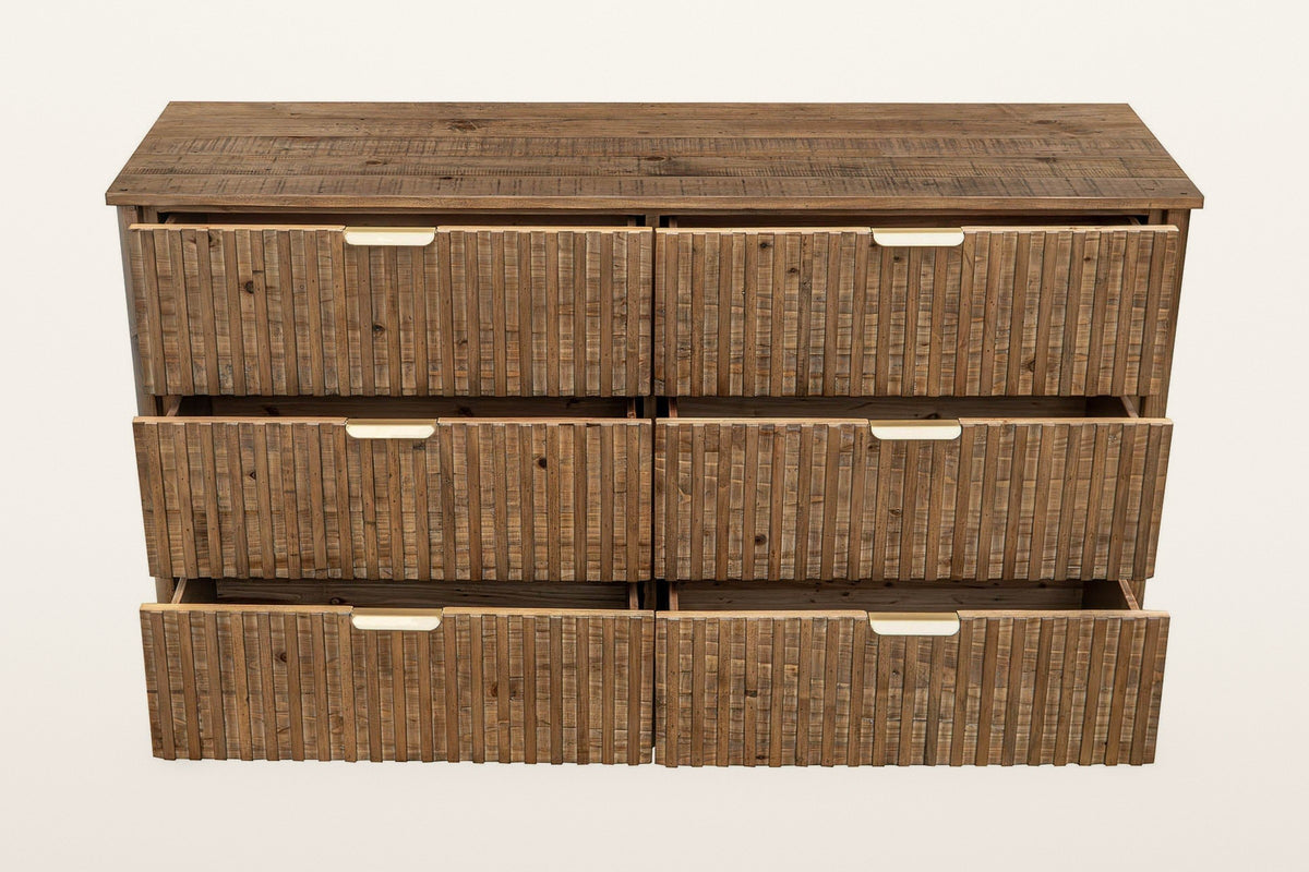 Pettorano dresser in Brown with all six drawers pulled out, front view on a warm white studio backdrop