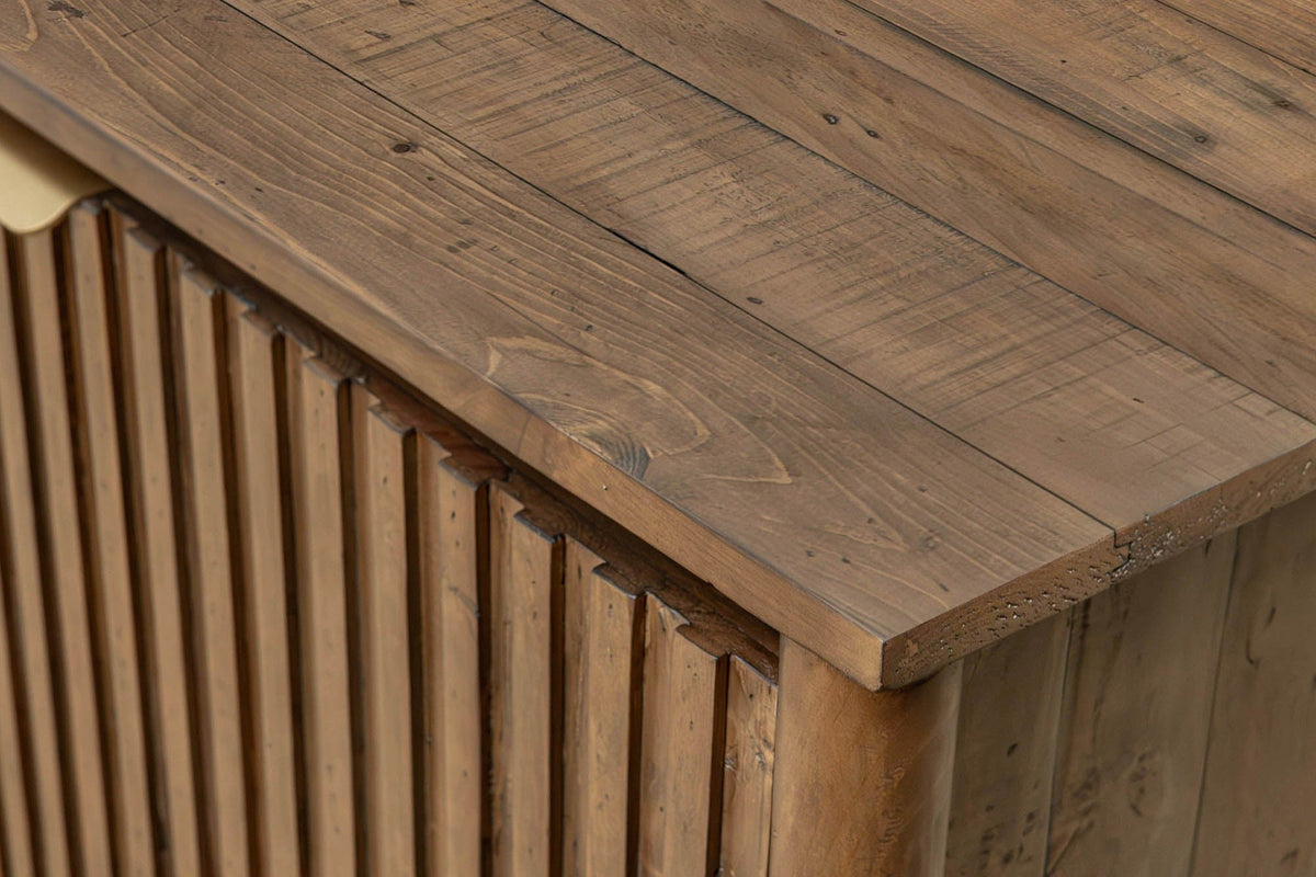 Close-up of the Pettorano top corner in Brown: reclaimed pine planks with saw marks and knots above the slatted doors and a r