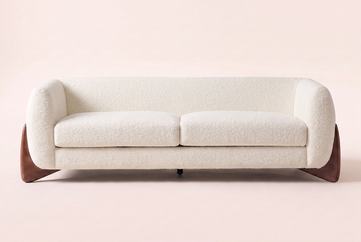 Pistoia sofa in Beige boucle, straight front view: rounded wrap-around arms, two seat cushions and walnut wedge feet