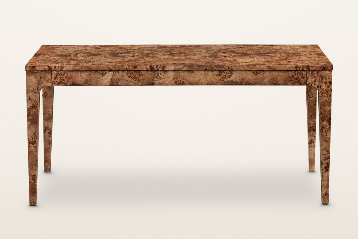Polcenigo dining table in Dark Burl, front view on a warm white studio backdrop