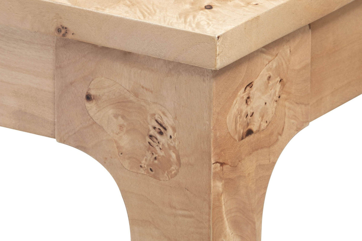 Close-up of the Polcenigo corner leg in Honey Blonde Burl: the square edge of the top over the leg