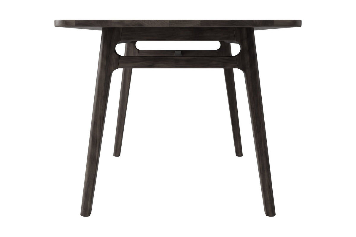 Prescott antique black dining table, end view showing the stretcher frame
