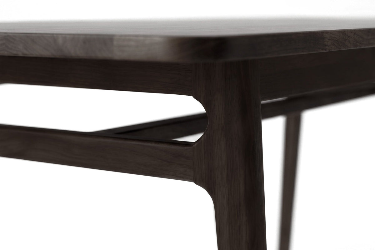 Prescott dining table close-up of the corner, tapered leg and stretcher