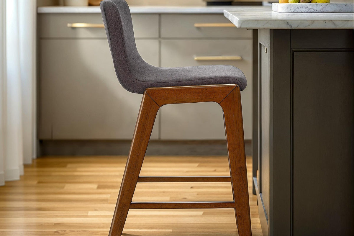 Prescott grey counter stool at a kitchen island with marble counter and oak floor