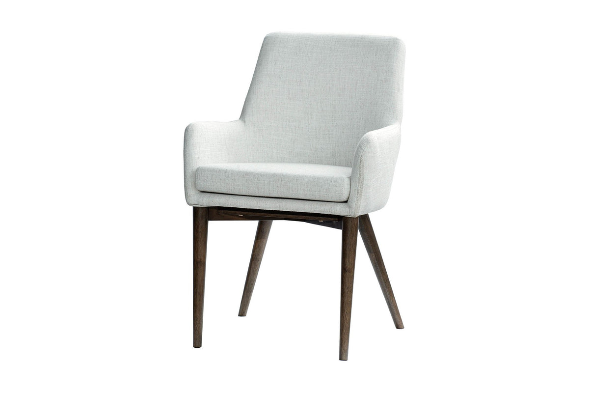 Radley ivory fabric arm dining chair with dark grey legs, three-quarter view