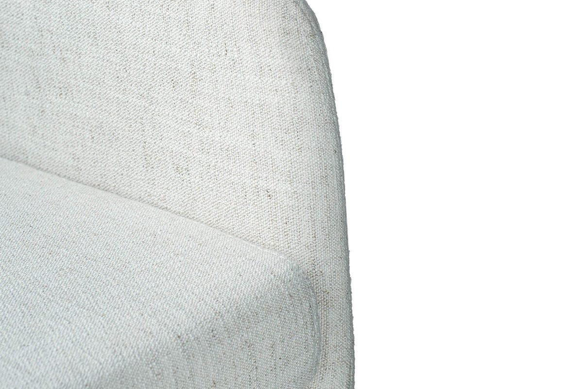 Radley dining chair close-up of the ivory woven fabric on the arm and seat